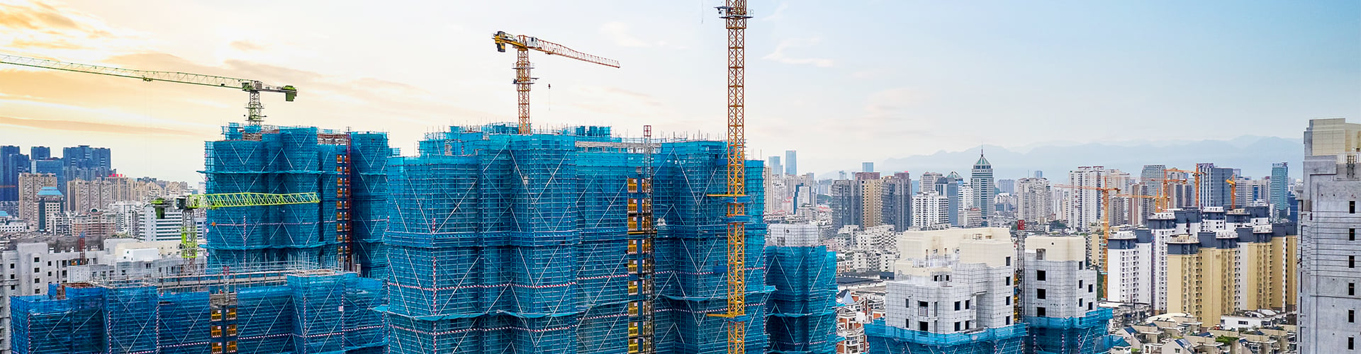 Cranes constructing skyscrapers